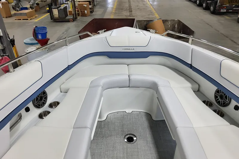  Yacht Photos Pics Luxurious seating area of 2026 Formula 310 Bowrider OB boat in a workshop setting.