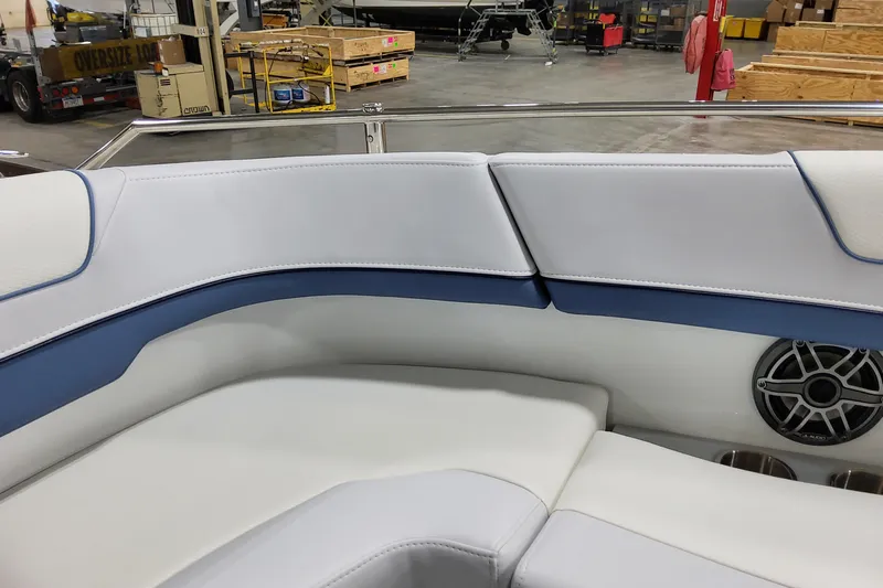  Yacht Photos Pics 2026 Formula 310 Bowrider OB interior with white and blue seating, speaker, and cup holders.