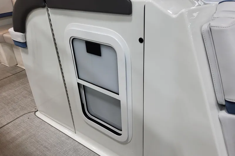  Yacht Photos Pics 2026 Formula 310 Bowrider OB interior detail, featuring sleek white paneling and seating.