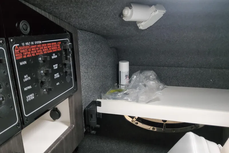  Yacht Photos Pics Interior of 2026 Formula 310 Bowrider OB showing control panel and storage area.