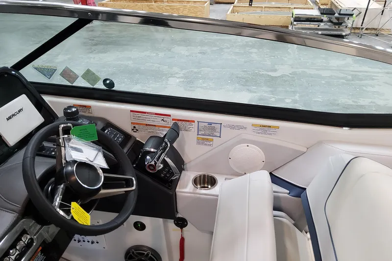  Yacht Photos Pics 2026 Formula 310 Bowrider OB cockpit with steering wheel, controls, and seating.