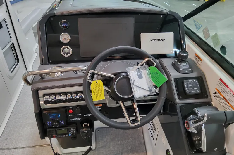  Yacht Photos Pics 2026 Formula 310 Bowrider OB dashboard with steering wheel and control panel.