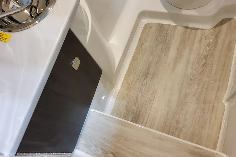  Yacht Photos Pics 2026 Formula 310 Bowrider OB interior with wood-style flooring and sleek design.