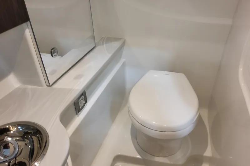  Yacht Photos Pics 2026 Formula 310 Bowrider OB bathroom with modern toilet and sleek design.