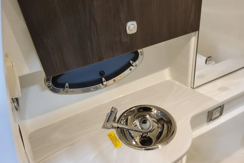  Yacht Photos Pics 2026 Formula 310 Bowrider OB interior with sleek sink and modern cabinetry.