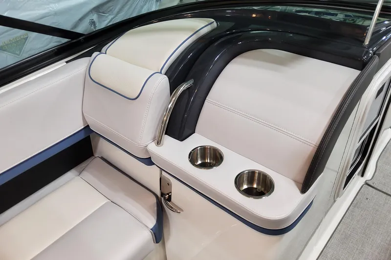  Yacht Photos Pics 2026 Formula 310 Bowrider OB interior with white seating and stainless steel cup holders.