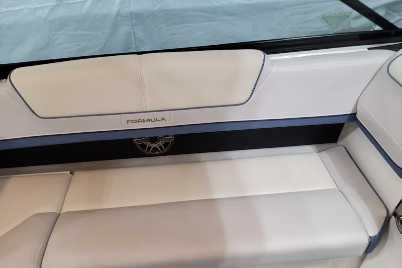  Yacht Photos Pics 2026 Formula 310 Bowrider OB interior seating with elegant white and blue upholstery.