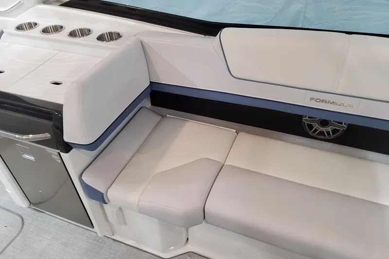  Yacht Photos Pics 2026 Formula 310 Bowrider OB interior with sleek seating and cup holders.