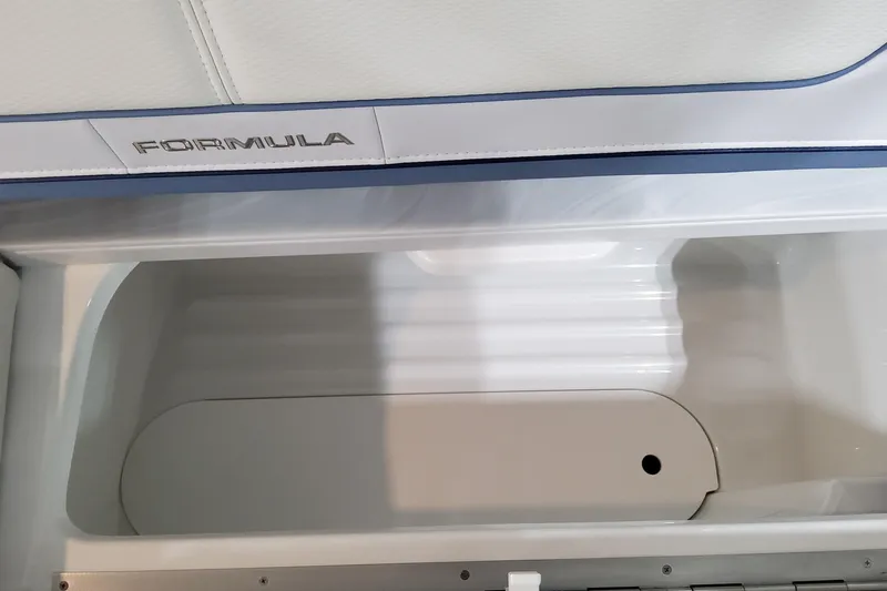 Yacht Photos Pics 2026 Formula 310 Bowrider OB storage compartment with sleek interior design.