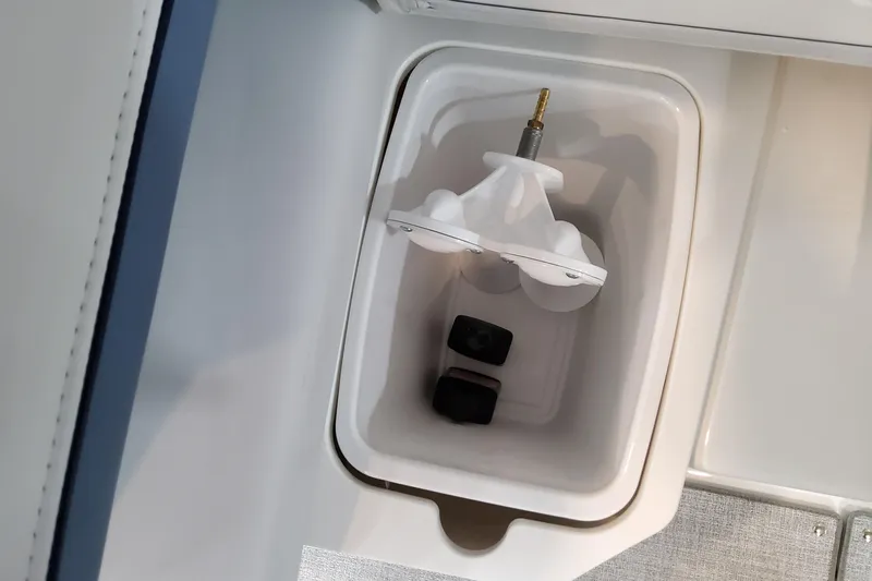  Yacht Photos Pics 2026 Formula 310 Bowrider OB boat compartment with white interior and mounted hardware.