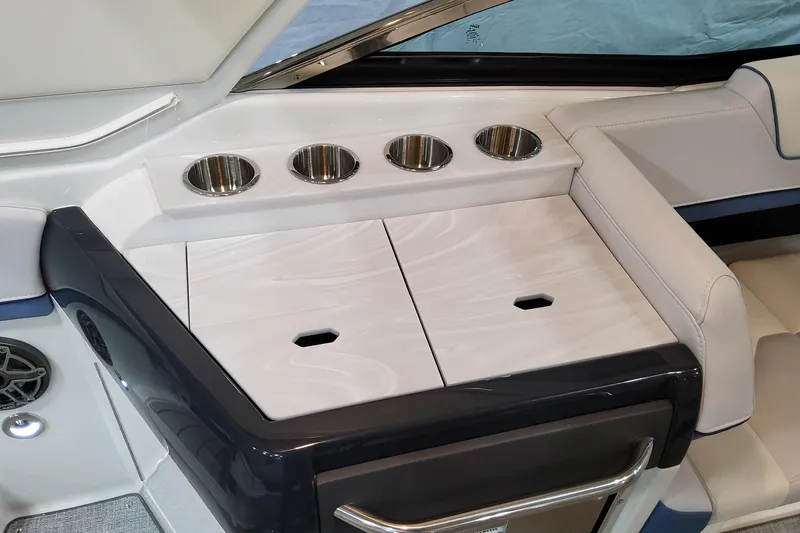  Yacht Photos Pics 2026 Formula 310 Bowrider OB interior with cup holders and sleek seating design.