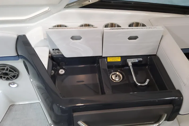  Yacht Photos Pics 2026 Formula 310 Bowrider OB boat interior with sink and storage compartments.