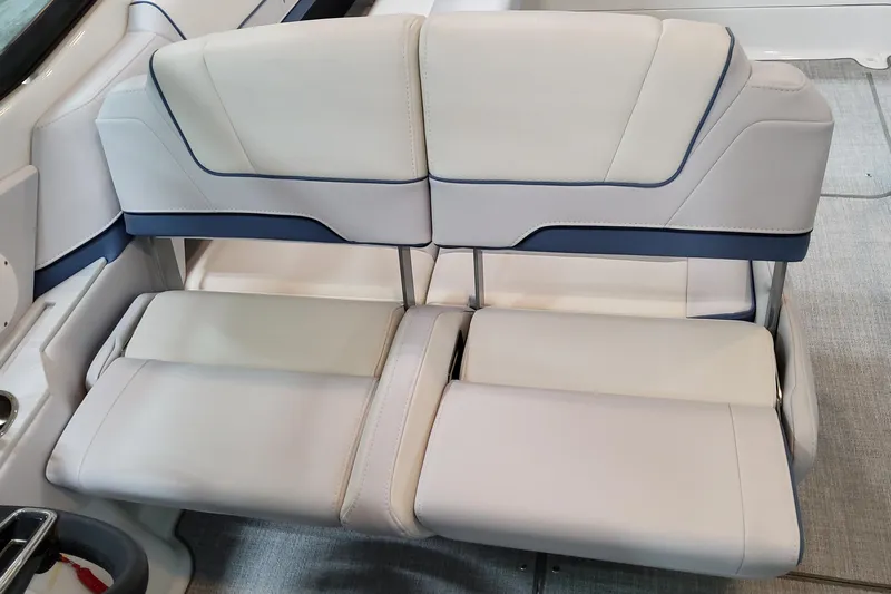  Yacht Photos Pics 2026 Formula 310 Bowrider OB interior seating, featuring luxurious white and blue upholstery.