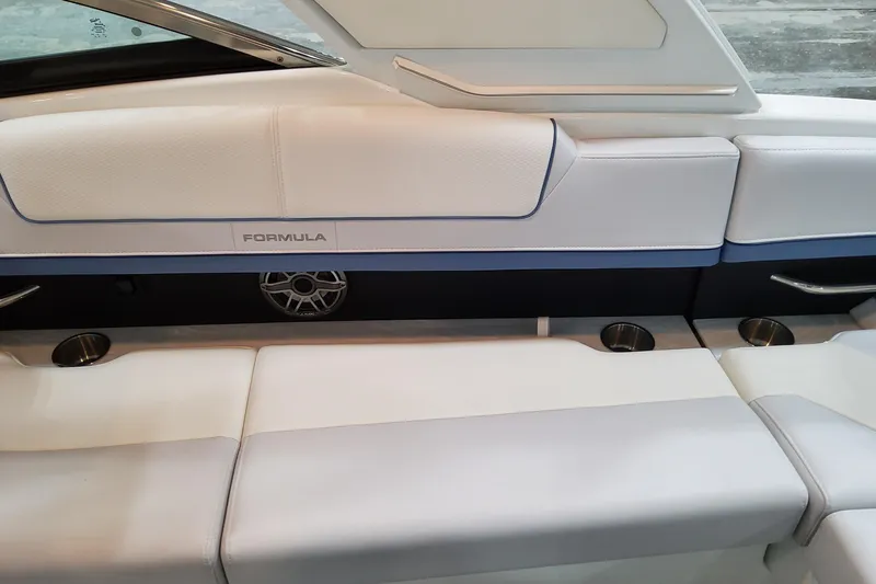  Yacht Photos Pics 2026 Formula 310 Bowrider OB interior seating with cup holders and speaker.