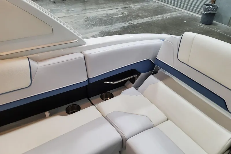  Yacht Photos Pics Luxurious seating in 2026 Formula 310 Bowrider OB boat, featuring elegant design and cup holders.