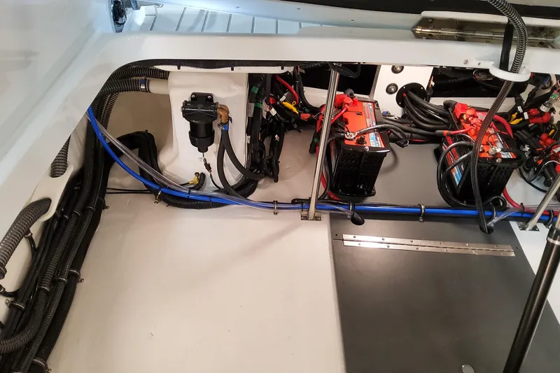  Yacht Photos Pics Engine compartment of 2026 Formula 310 Bowrider OB, showcasing wiring and battery setup.