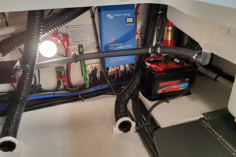  Yacht Photos Pics Engine compartment of 2026 Formula 310 Bowrider OB with battery and wiring system.