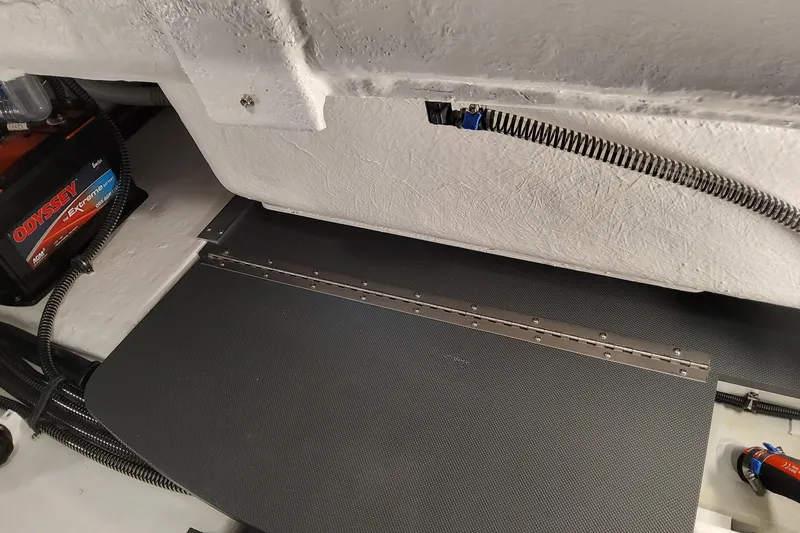  Yacht Photos Pics Interior view of 2026 Formula 310 Bowrider OB boat, featuring battery and wiring.