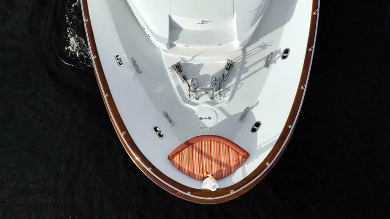 Waterford (name Reserved) Yacht Photos Pics Aerial view of 2016 Sovereign Pilothouse yacht's bow on dark water.