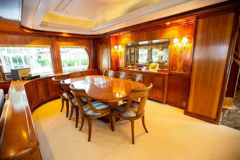 Waterford (name Reserved) Yacht Photos Pics Luxurious dining area on 2016 Sovereign Pilothouse yacht with elegant wood paneling.