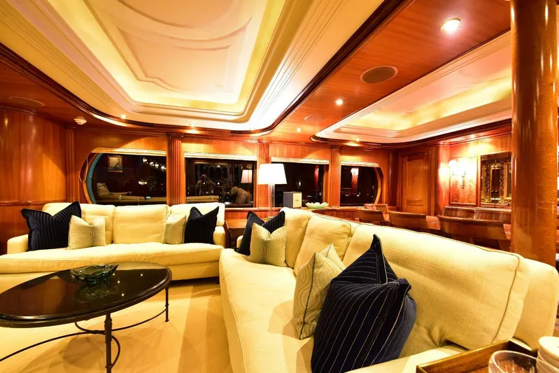 Waterford (name Reserved) Yacht Photos Pics Luxurious yacht interior with elegant sofas, wooden paneling, and ambient lighting, Sovereign 2016 model.