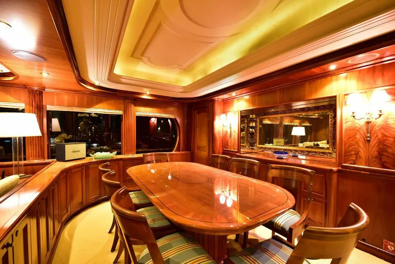 Waterford (name Reserved) Yacht Photos Pics Luxurious yacht dining area with elegant wood paneling and ambient lighting, 2016 Sovereign model.