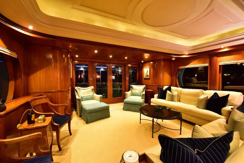 Waterford (name Reserved) Yacht Photos Pics Luxurious yacht interior with elegant seating, warm lighting, and polished wood finishes.