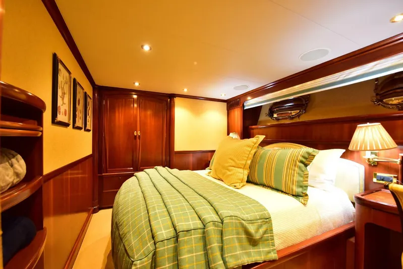 Waterford (name Reserved) Yacht Photos Pics Luxurious bedroom in 2016 Sovereign Pilothouse yacht with elegant wood finishes and cozy bedding.
