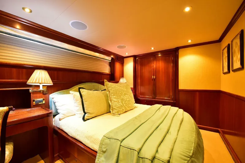 Waterford (name Reserved) Yacht Photos Pics Luxurious yacht bedroom with elegant wood paneling and cozy bedding, 2016 Sovereign Pilothouse.