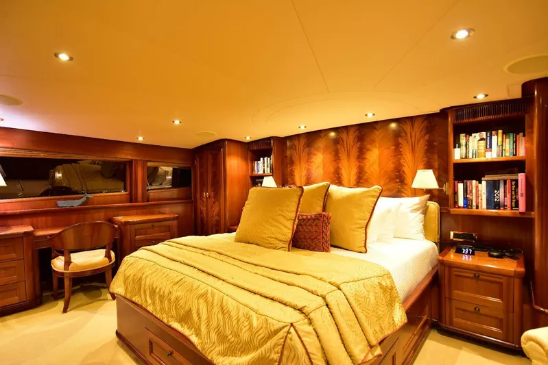 Waterford (name Reserved) Yacht Photos Pics Luxurious yacht bedroom with wood paneling, plush bedding, and built-in bookshelves, 2016 Sovereign model.