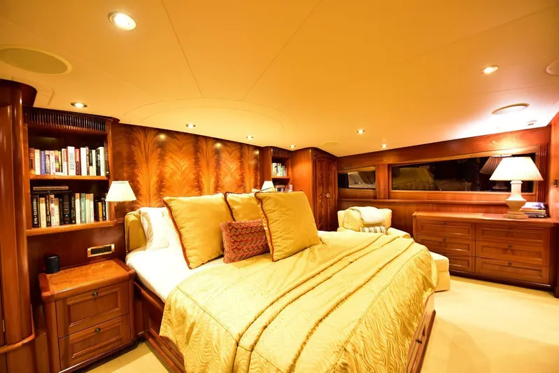 Waterford (name Reserved) Yacht Photos Pics Luxurious bedroom in 2016 Sovereign Pilothouse yacht with elegant wood furnishings and ambient lighting.