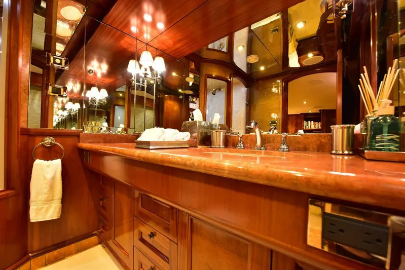 Waterford (name Reserved) Yacht Photos Pics Luxurious yacht bathroom with wooden cabinetry and elegant lighting, 2016 Sovereign Pilothouse model.