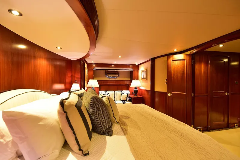 Waterford (name Reserved) Yacht Photos Pics Luxurious yacht bedroom with elegant wood paneling and plush bedding, 2016 Sovereign Pilothouse.