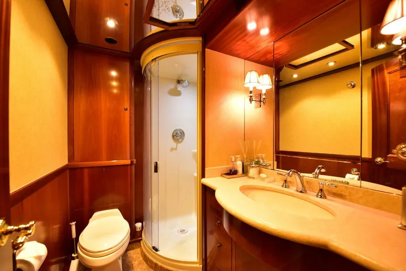 Waterford (name Reserved) Yacht Photos Pics Luxurious yacht bathroom with wood paneling, shower, and elegant fixtures, 2016 Sovereign model.