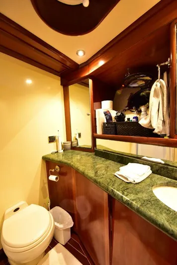 Waterford (name Reserved) Yacht Photos Pics Luxurious yacht bathroom with green marble countertop and wooden accents, 2016 Sovereign Pilothouse.