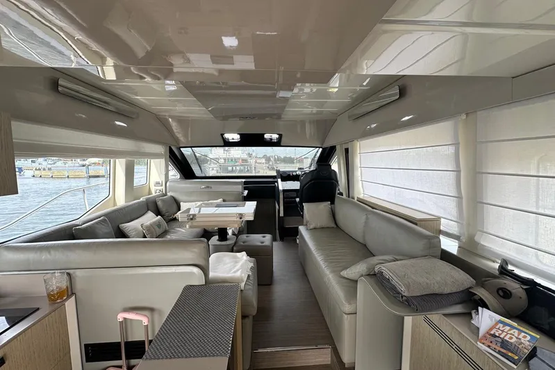  Yacht Photos Pics Luxurious interior of a 2018 Cranchi E52F yacht with elegant seating and modern decor.