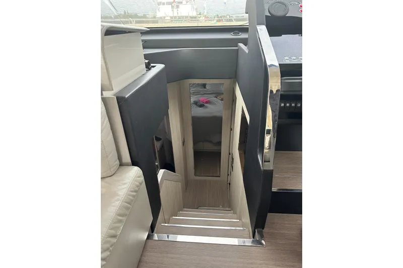  Yacht Photos Pics Staircase leading below deck on 2018 Cranchi E52F yacht interior.