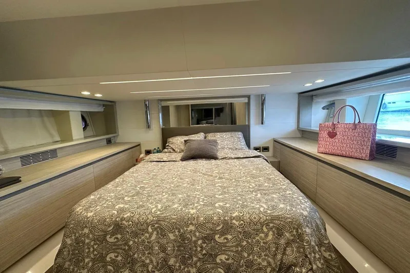  Yacht Photos Pics Luxurious bedroom interior of 2018 Cranchi E52F yacht with elegant bedding and stylish decor.