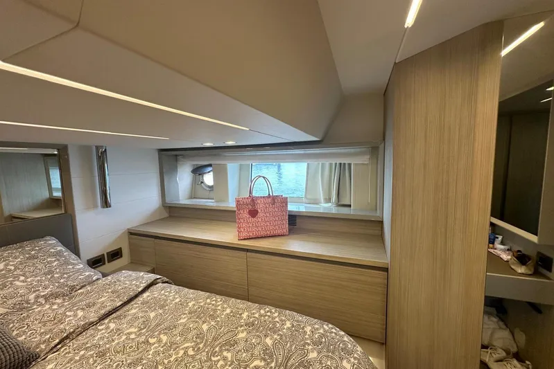  Yacht Photos Pics Luxurious 2018 Cranchi E52F yacht bedroom with elegant wood finishes and stylish decor.
