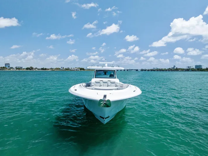  Yacht Photos Pics 2025 HCB 56' Sueños GIX yacht on clear blue water under a sunny sky.