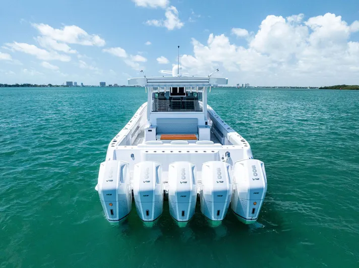  Yacht Photos Pics 2025 HCB 56' Sueños GIX luxury boat with five powerful outboard engines on open water.