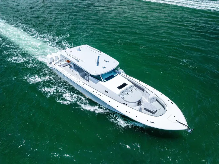  Yacht Photos Pics 2025 HCB 56' Sueños GIX luxury yacht cruising on open water.