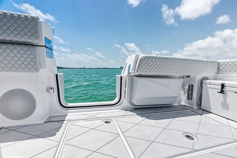  Yacht Photos Pics 2025 HCB 56' Sueños GIX boat interior with ocean view, featuring luxurious seating and modern design.