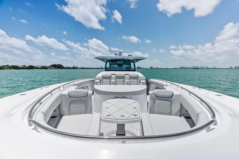  Yacht Photos Pics 2025 HCB 56' Sueños GIX luxury yacht on open water, clear sky background.