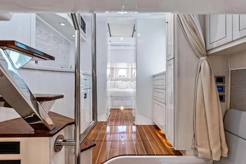  Yacht Photos Pics Luxurious interior of 2025 HCB 56' Sueños GIX yacht with elegant wood flooring.