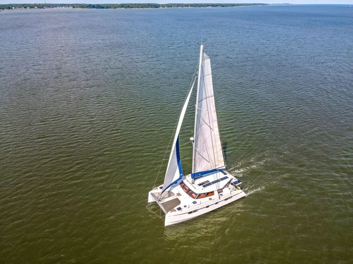 Vlaroda Yacht Photos Pics Aerial view of 2017 Nautitech 46 Open catamaran sailing on open water.