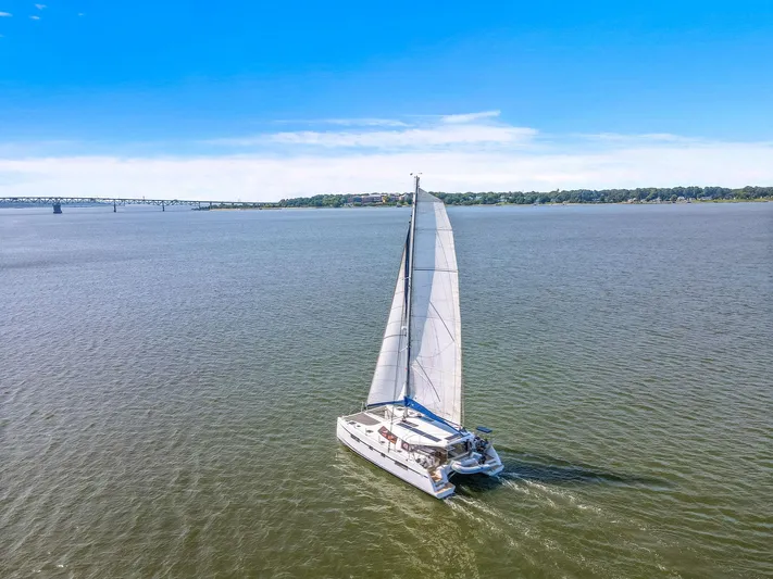 Vlaroda Yacht Photos Pics Sailing catamaran Nautitech 46 Open, 2017 model, cruising on open water under clear blue skies.