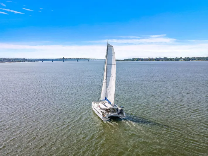 Vlaroda Yacht Photos Pics Sailing catamaran Nautitech 46 Open 2017 on open water under clear blue sky.
