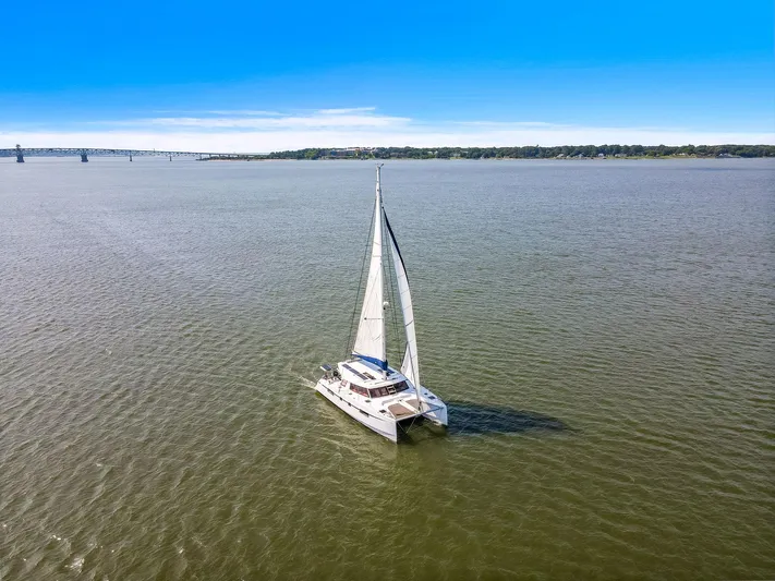 Vlaroda Yacht Photos Pics Sailing catamaran Nautitech 46 Open 2017 on open water under clear blue sky.
