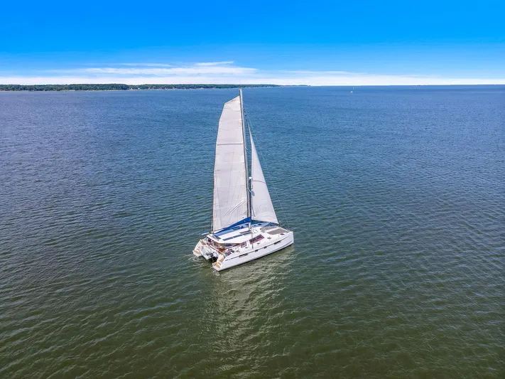 Vlaroda Yacht Photos Pics Sailing catamaran Nautitech 46 Open 2017 on open water under clear blue sky.